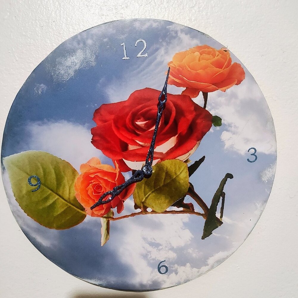 Red rose  in the sly clock